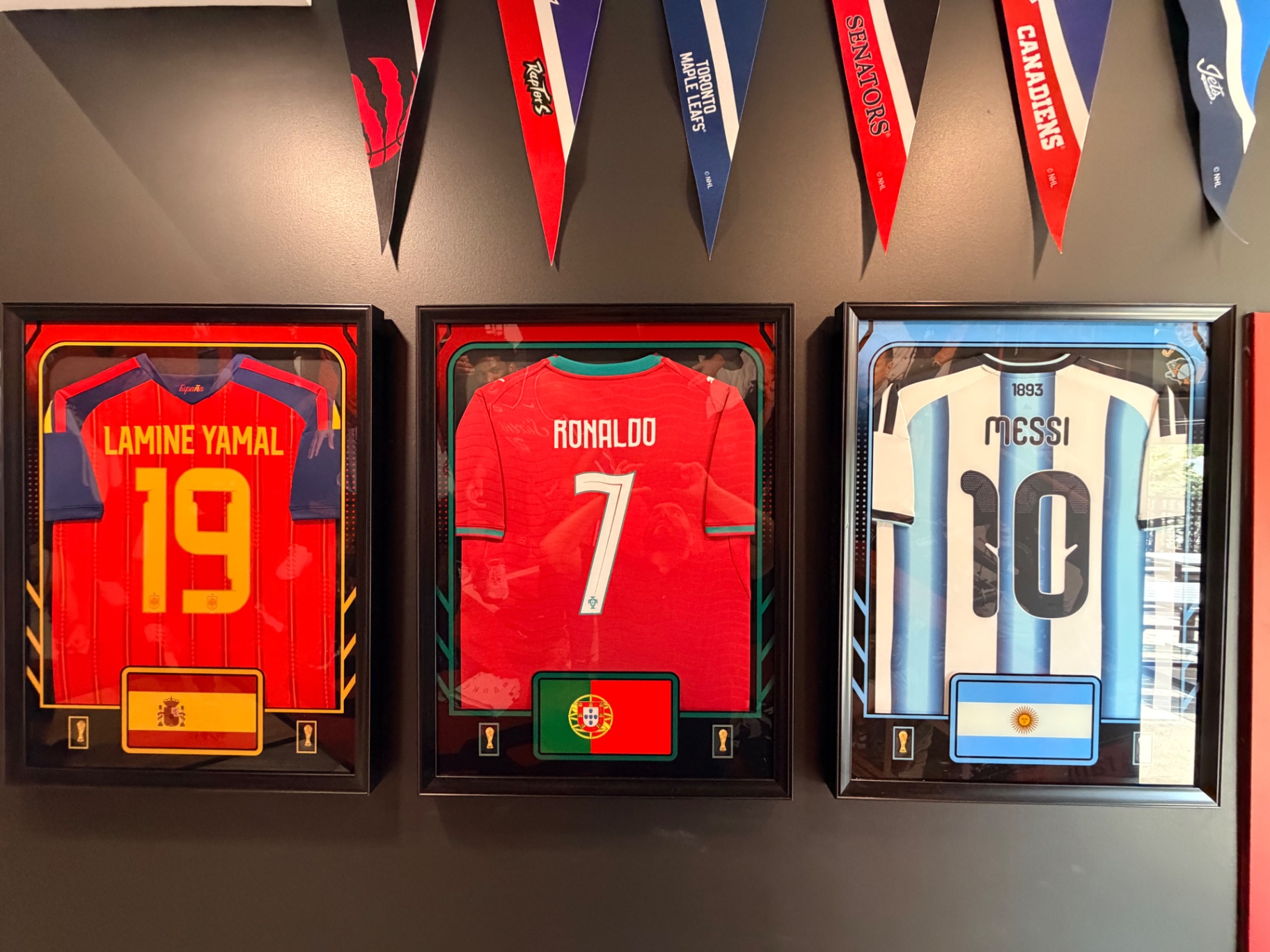 Framed Lamine Yamal, Ronaldo and Messi jerseys at Hall of Flame